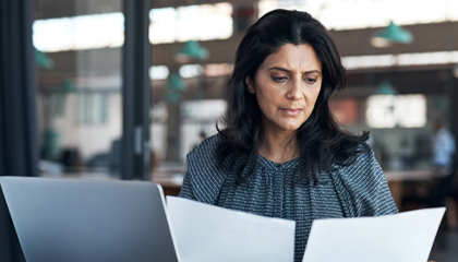 Business woman with documents.