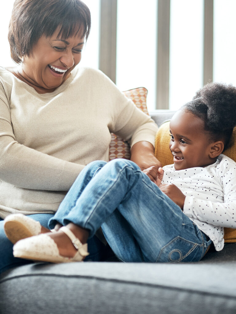 Grandmother playing with granddaughter.