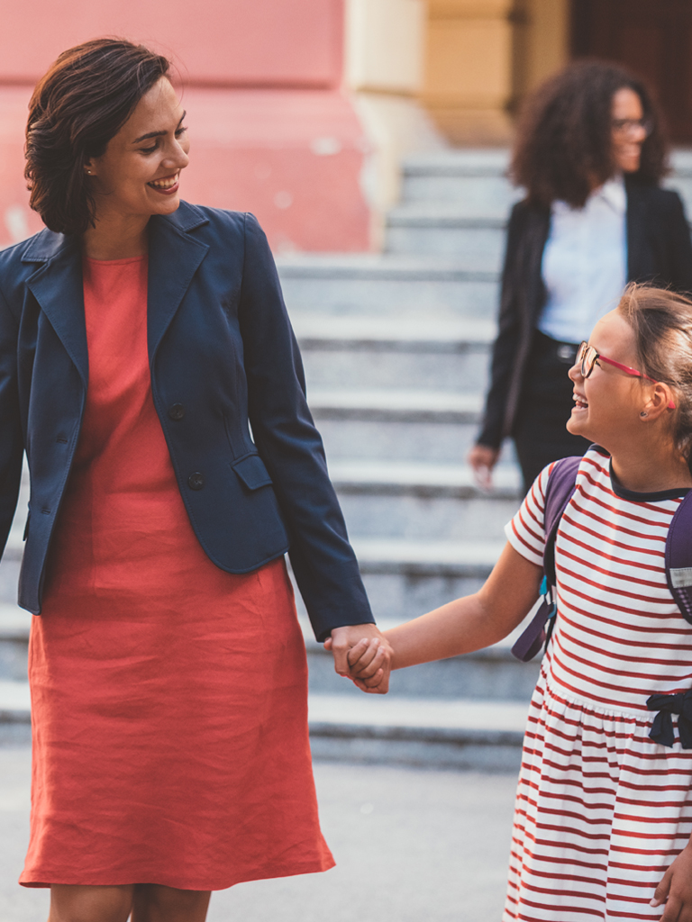 Mother picking up children from school.