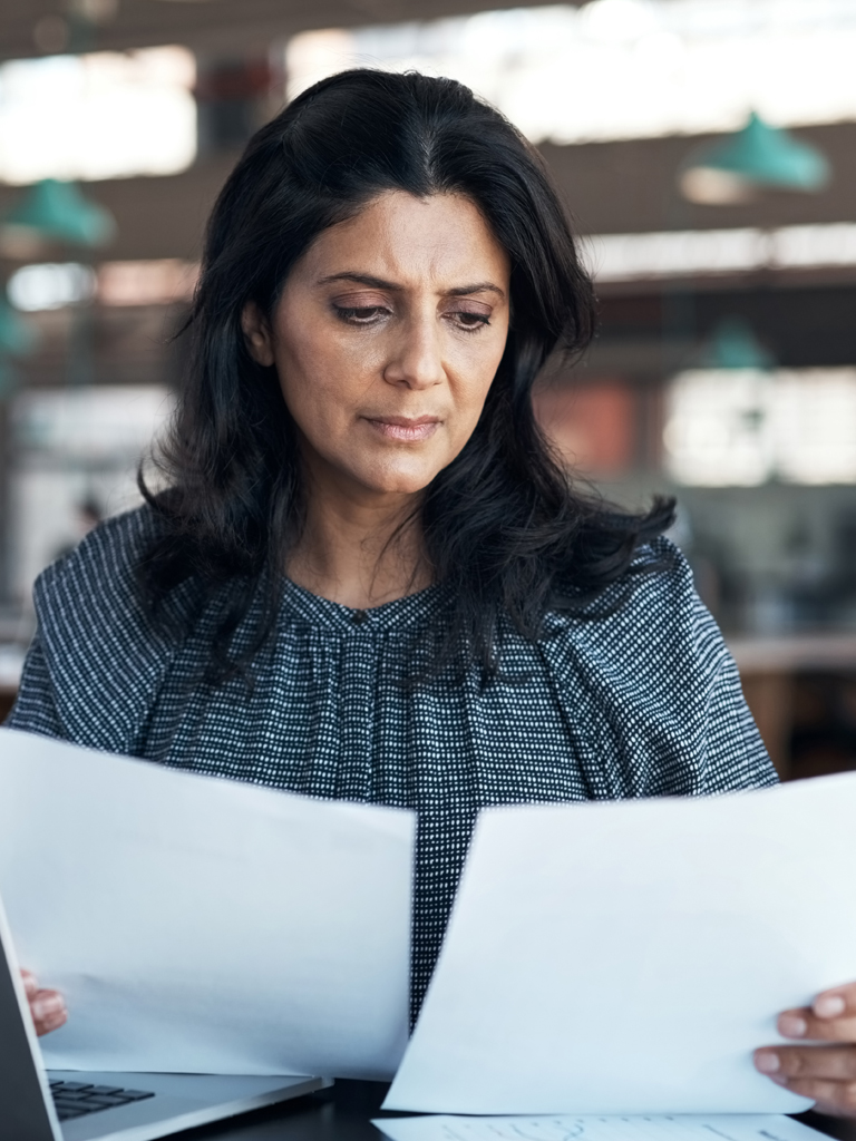 Woman studying documents.