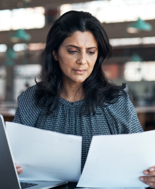 Business woman reviewing documents.