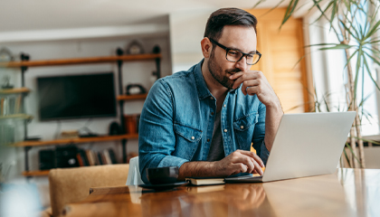 Professional-man-working-on-laptop-computer