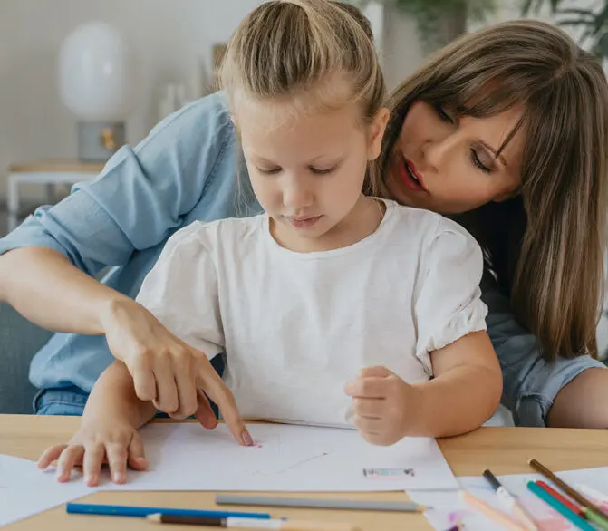 Mother helping child with homework